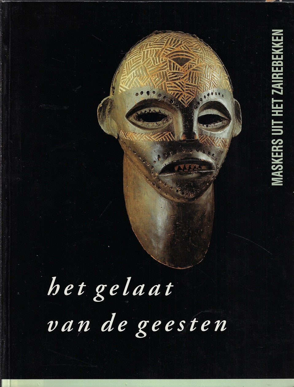 Omslag van Het Gelaat van de Geesten / Maskers uit het Zaïrebekken, tweedehands boek bij Boekhandel Bloks
